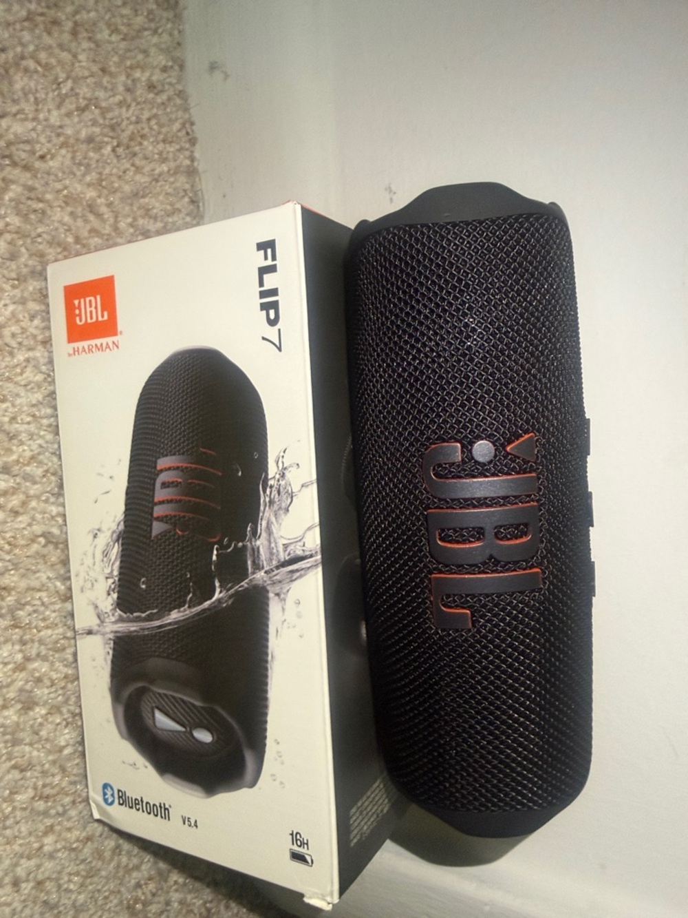 JBL Flip 7 Portable Bluetooth Speaker - Black with Orange Accents